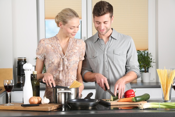 Cooking in the kitchen couple Stock Photo