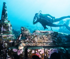 Diver with underwater artifacts Stock Photo
