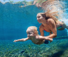 Diving mother and son Stock Photo