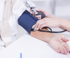 Doctors check the blood pressure for the elderly Stock Photo