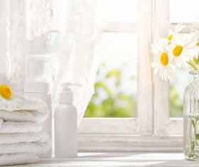 Embossed flower and towel on the windowsill Stock Photo