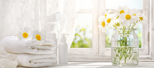 Embossed flower and towel on the windowsill Stock Photo