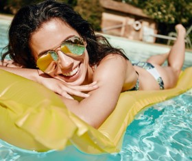 Enjoy the sunbathing woman in the pool Stock Photo 12