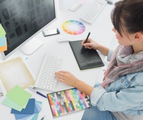 Female designers use computers Stock Photo