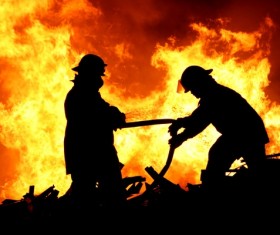Firefighters extinguishing Stock Photo