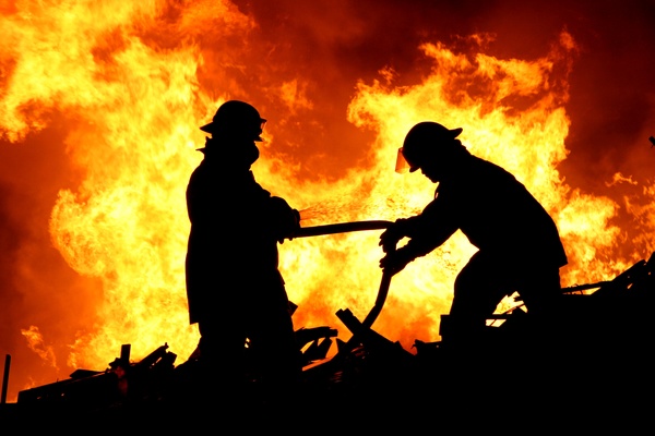Firefighters extinguishing Stock Photo