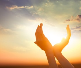 Holding the sun in hand Stock Photo