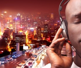 Listen to music with man and city night view Stock Photo