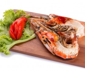 Lobster on the chopping board with vegetables and tomatoes Stock Photo