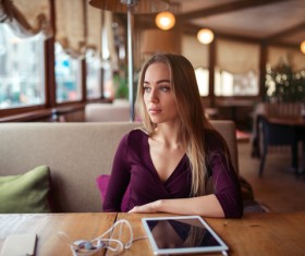 Looking out of the window at the woman in the cafe Stock Photo