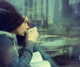 Reading girl drinking coffee Stock Photo