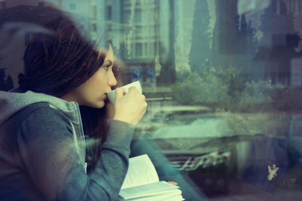 Reading girl drinking coffee Stock Photo