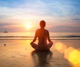 Sitting on the beach watching the sunrise Stock Photo