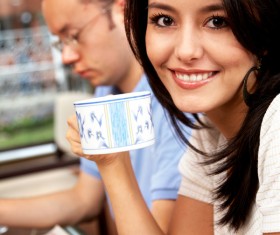 Smiling woman drinking coffee Stock Photo
