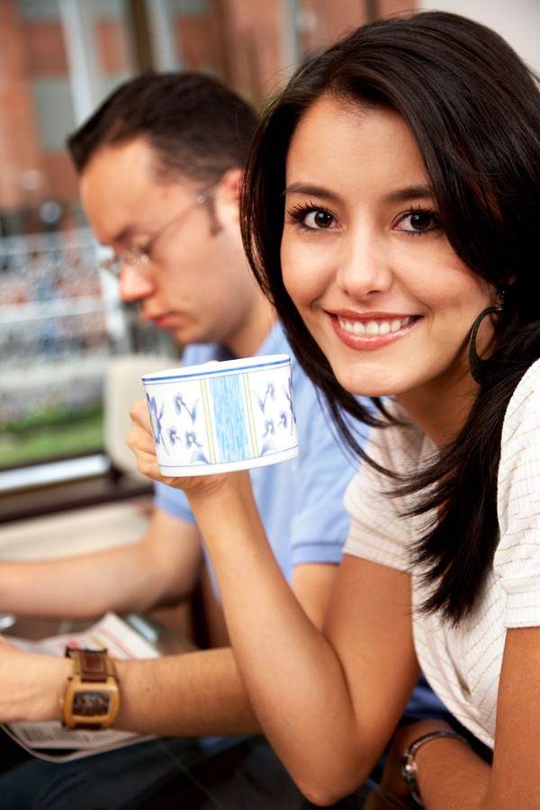 Smiling woman drinking coffee Stock Photo