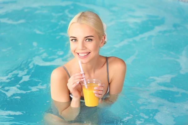 Stock Photo Girl drinking juice in a jacuzzi 01