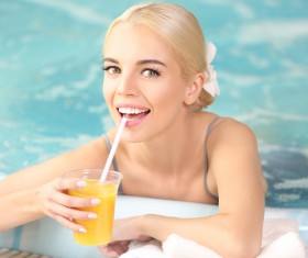 Stock Photo Girl drinking juice in a jacuzzi 02