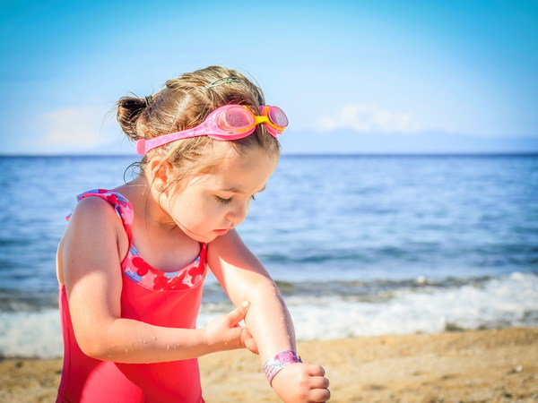Summer little girl on the beach Stock Photo