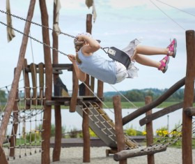 Swing the little girl Stock Photo