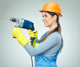Take a female worker with an electric drill Stock Photo