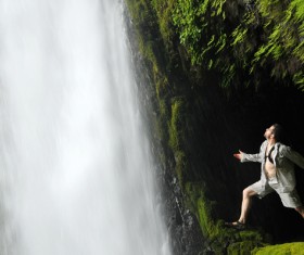 The man looking up at the Falls Stock Photo
