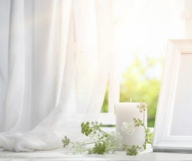 The windowsill candles and frames Stock Photo