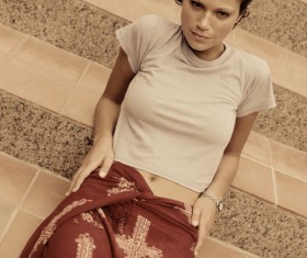 The woman sitting on the steps Stock Photo