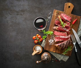 Undercooked meat and spices on the chopping block Stock Photo 01