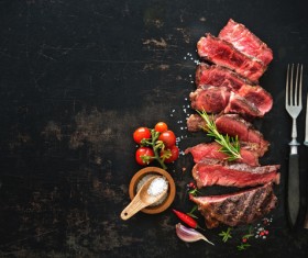 Undercooked meat and spices on the chopping block Stock Photo 02