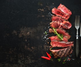 Undercooked meat and spices on the chopping block Stock Photo 03