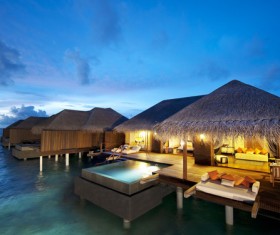 Water thatched cottage Stock Photo