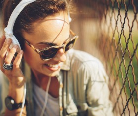 Wearing headphones listening to music young girl Stock Photo 02