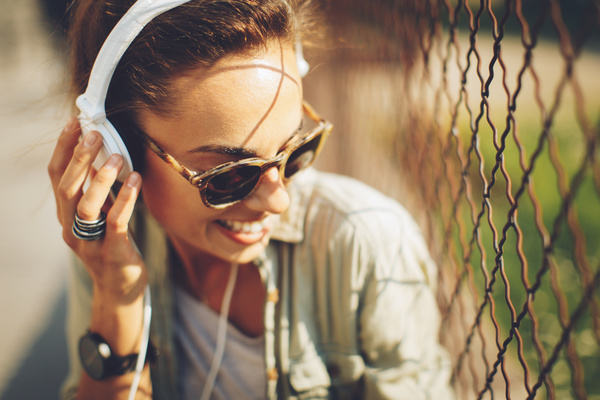 Wearing headphones listening to music young girl Stock Photo 02