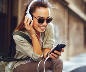 Wearing headphones listening to music young girl Stock Photo 03