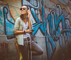 Wearing headphones listening to music young girl Stock Photo 04