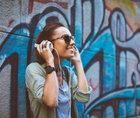 Wearing headphones listening to music young girl Stock Photo 05