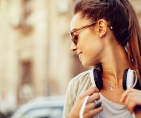 Wearing headphones listening to music young girl Stock Photo 06