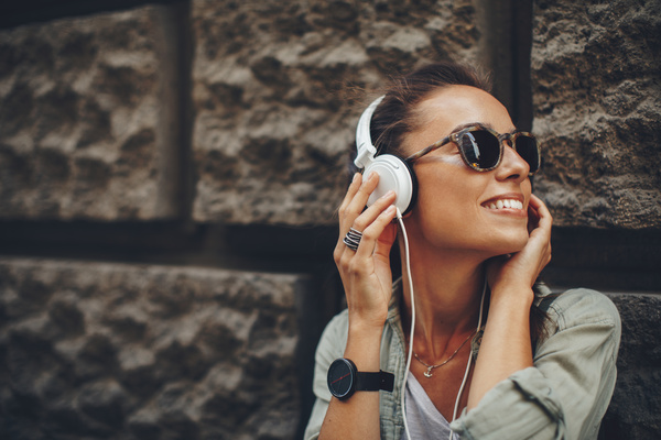 Wearing headphones listening to music young girl Stock Photo 09
