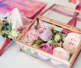 Wedding rings and bouquets on the table Stock Photo