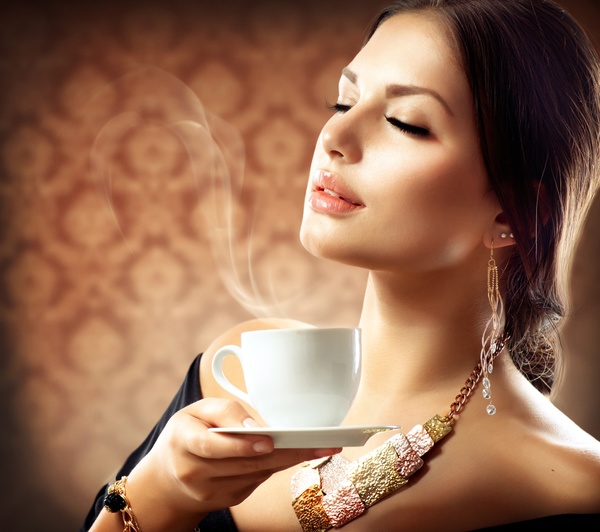 Woman holding a coffee cup Stock Photo