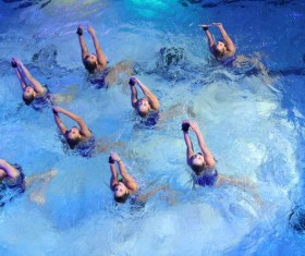 Woman synchronized swimming Stock Photo