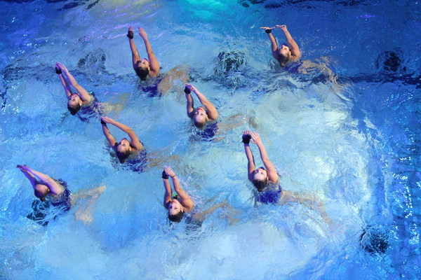 Woman synchronized swimming Stock Photo
