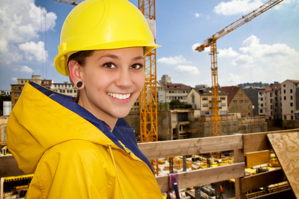 Woman wearing a raincoat at the construction site Stock Photo