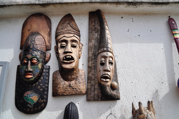 Wooden masks hanging from the wall Stock Photo