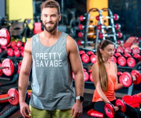 Workout in the gym for men and women Stock Photo 01