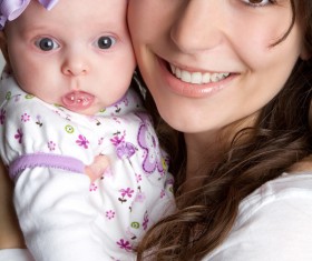 Young mother holding newborn child Stock Photo
