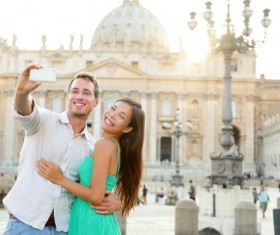 couple who took pictures before the Romanesque building Stock Photo