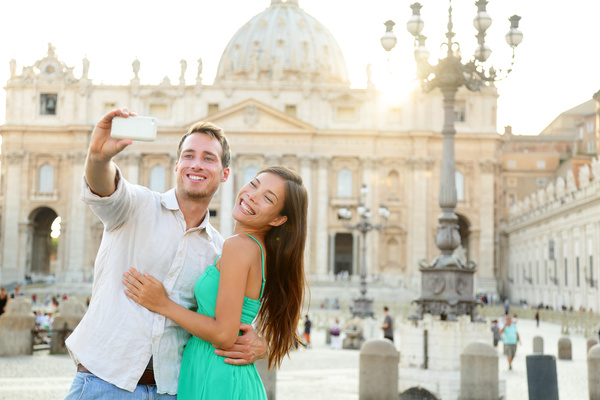 couple who took pictures before the Romanesque building Stock Photo