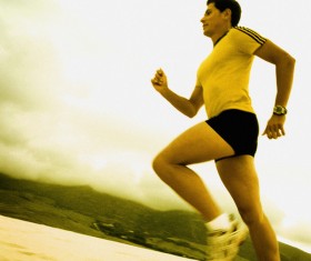 man running on the beach Stock Photo