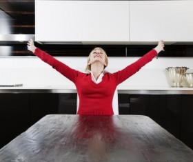 woman stretching her arms at the table Stock Photo